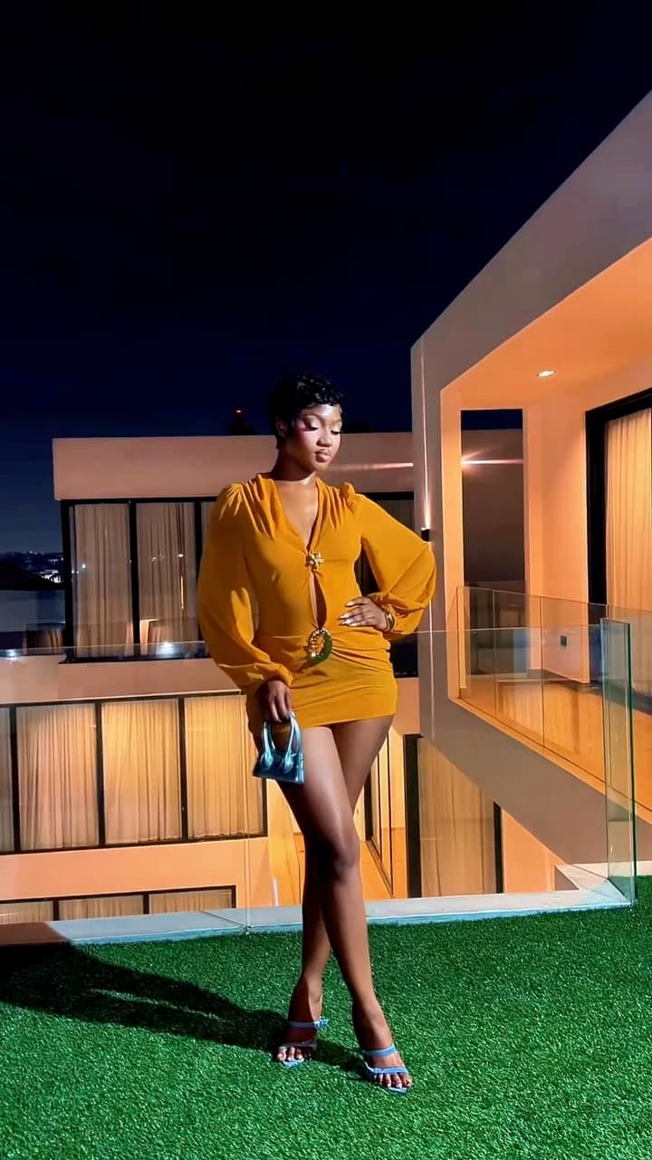 Lensory film featuring the same subject in a mustard outfit.